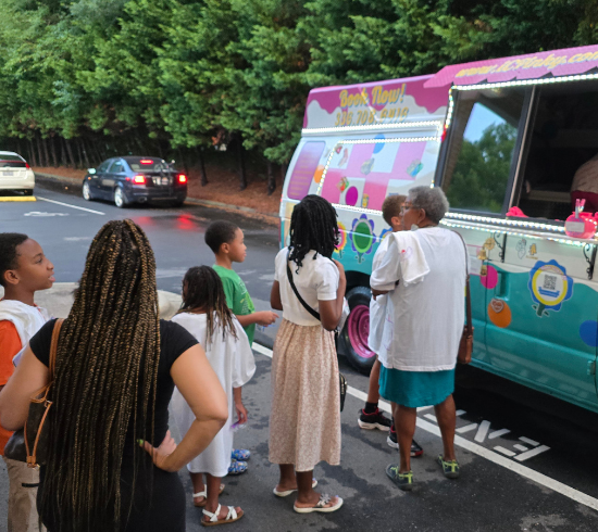 students get ice cream from Pinky's Experience Ice Cream Truck