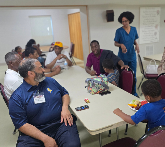 families chat during dinner before class