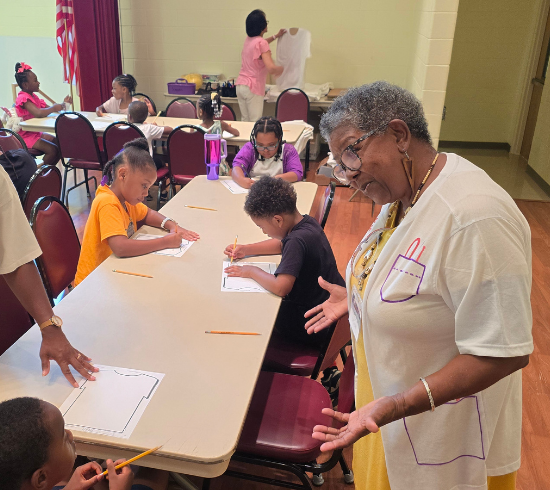 arts and crafts teacher speaking with student
