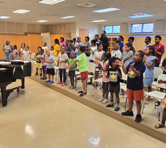 children and youth in choir room for rehearsal